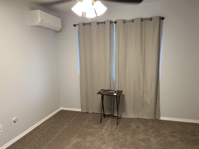 spare room featuring an AC wall unit, ceiling fan, and carpet flooring