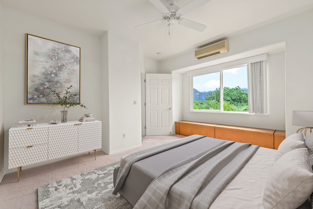 carpeted bedroom featuring ceiling fan and a wall unit AC