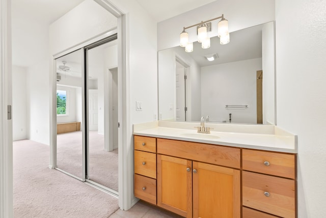 bathroom featuring vanity and ceiling fan