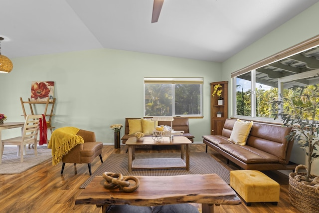 living room with ceiling fan, hardwood / wood-style floors, and lofted ceiling