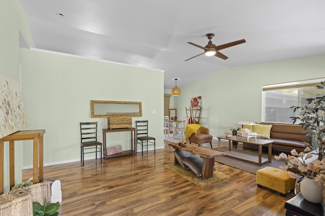 living room featuring vaulted ceiling, ceiling fan, and dark hardwood / wood-style flooring