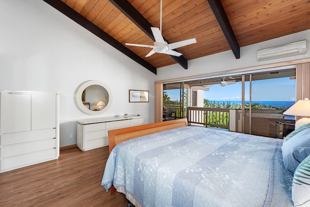 bedroom featuring access to outside, a wall mounted AC, ceiling fan, hardwood / wood-style flooring, and beamed ceiling