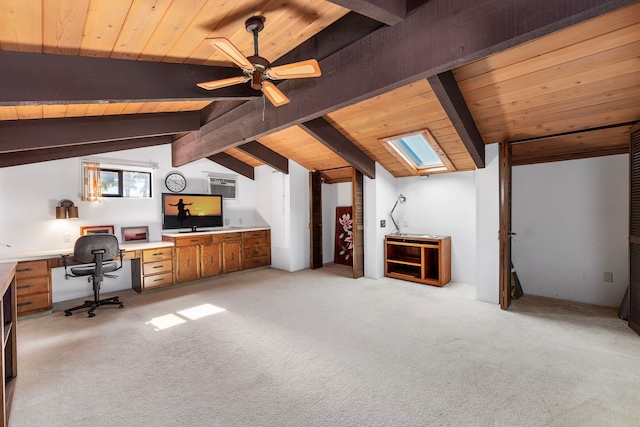 unfurnished office featuring vaulted ceiling with beams, light carpet, built in desk, and wooden ceiling