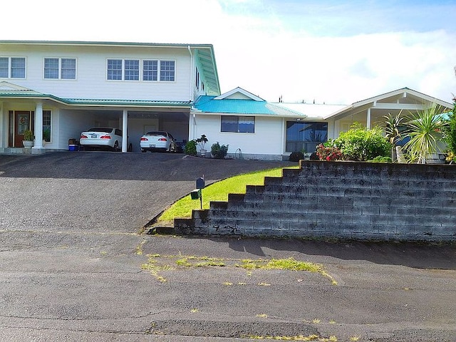 view of front facade with a carport