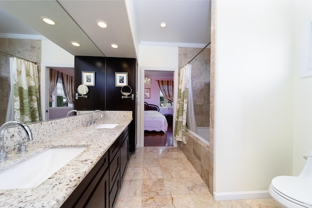 full bathroom with vanity, toilet, crown molding, and shower / tub combo