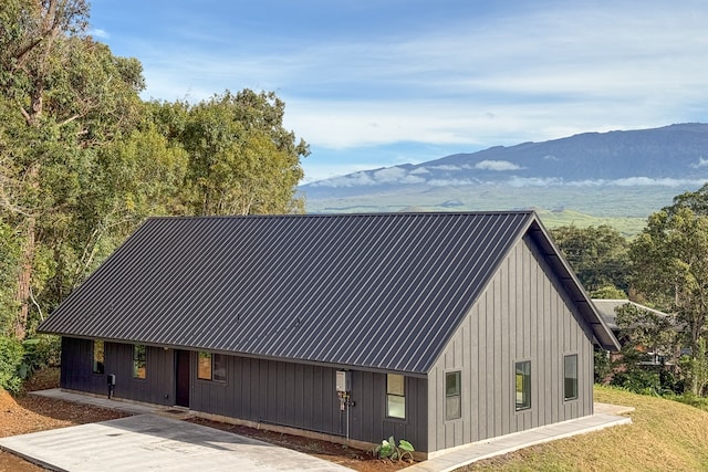 back of property featuring a mountain view