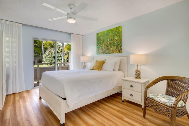 bedroom with ceiling fan and light hardwood / wood-style floors