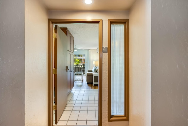 hallway featuring a textured ceiling