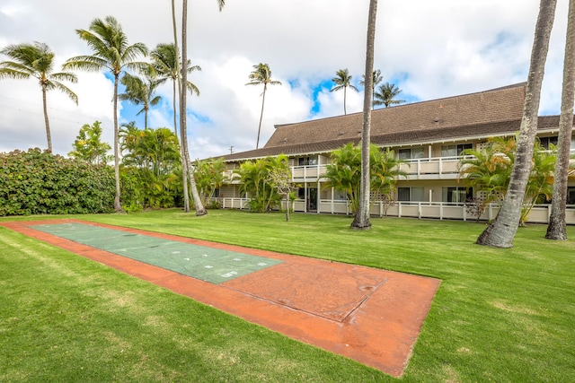 surrounding community featuring a lawn