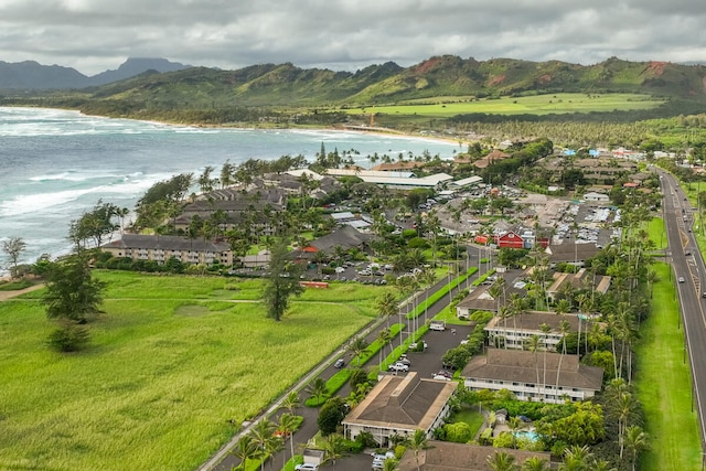 aerial view featuring a water and mountain view