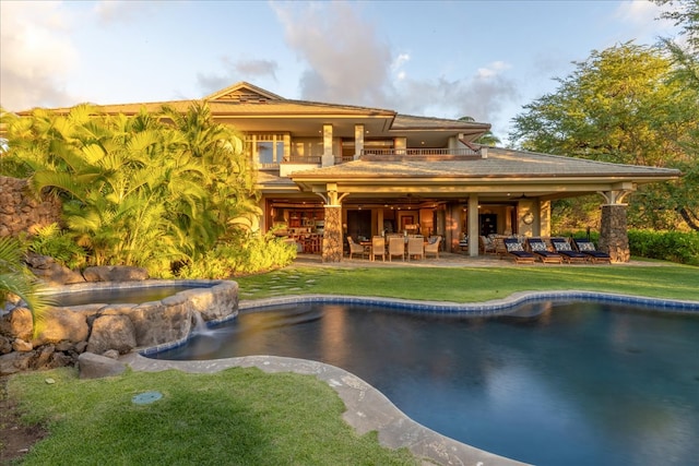 view of pool featuring a yard and a patio area