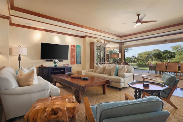 carpeted living room with ceiling fan and crown molding