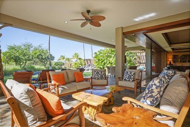 sunroom with ceiling fan