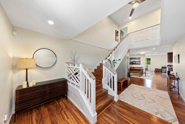 staircase with hardwood / wood-style floors