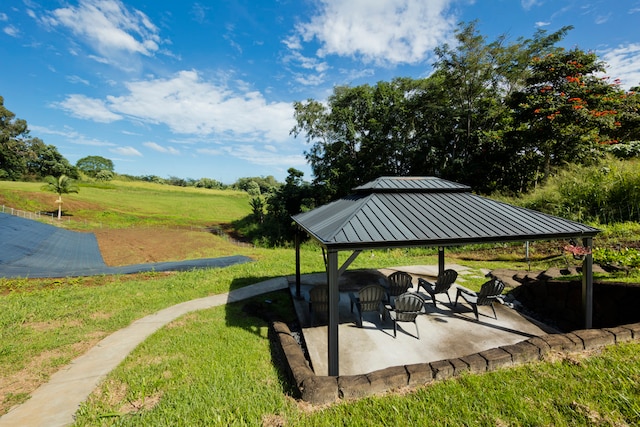 surrounding community featuring a gazebo, a patio, and a yard