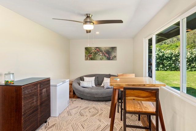 sitting room with ceiling fan and a healthy amount of sunlight