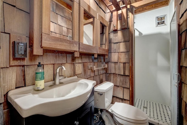 full bath with toilet, a stall shower, and vanity