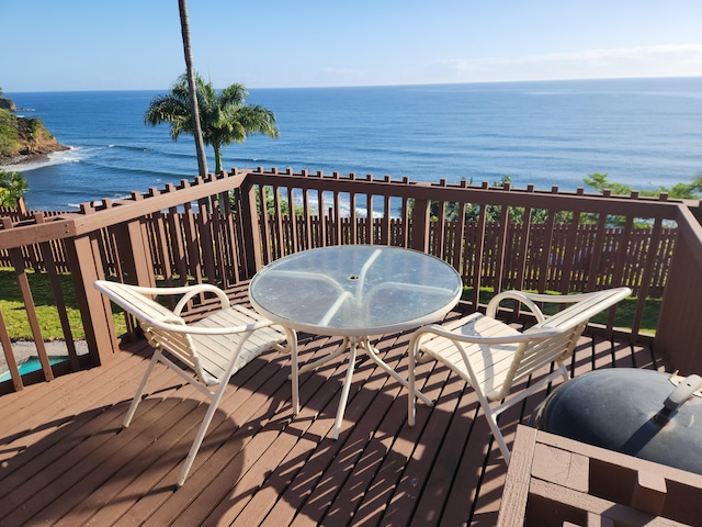 wooden deck with a water view