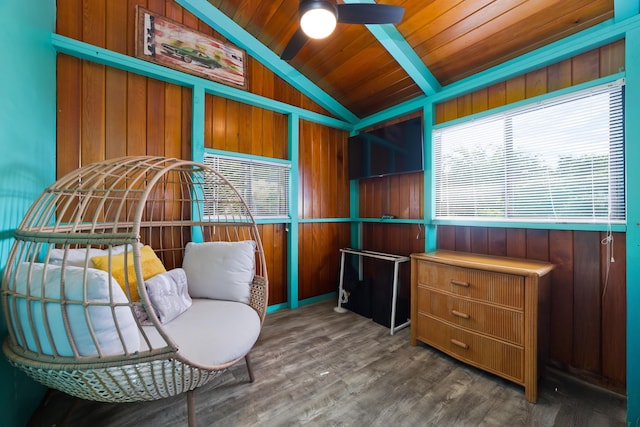 sitting room with a healthy amount of sunlight, dark hardwood / wood-style flooring, wood ceiling, and vaulted ceiling