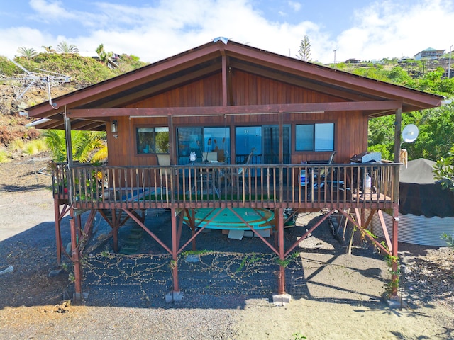 rear view of house with a wooden deck