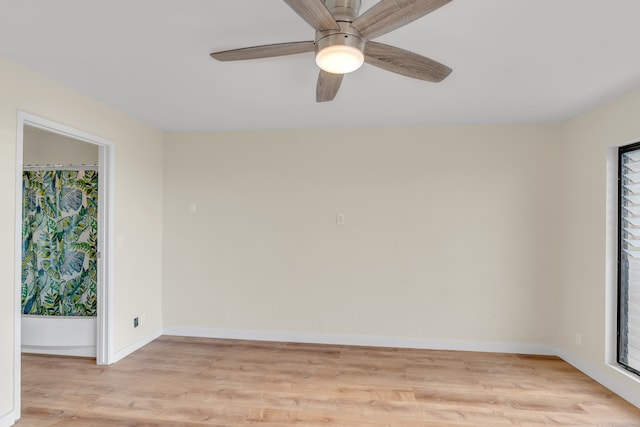 empty room with light hardwood / wood-style floors and ceiling fan