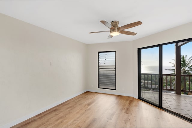 unfurnished room with ceiling fan and light hardwood / wood-style floors