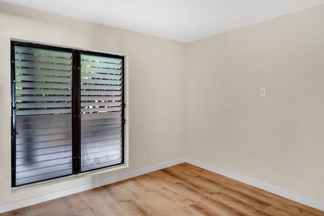 spare room featuring light hardwood / wood-style flooring