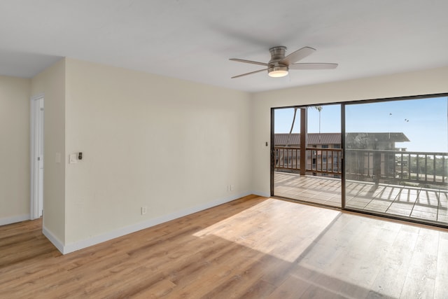 unfurnished room with hardwood / wood-style flooring and ceiling fan