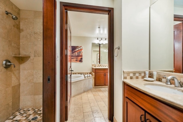 bathroom featuring vanity and independent shower and bath