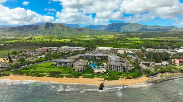 drone / aerial view with a water and mountain view