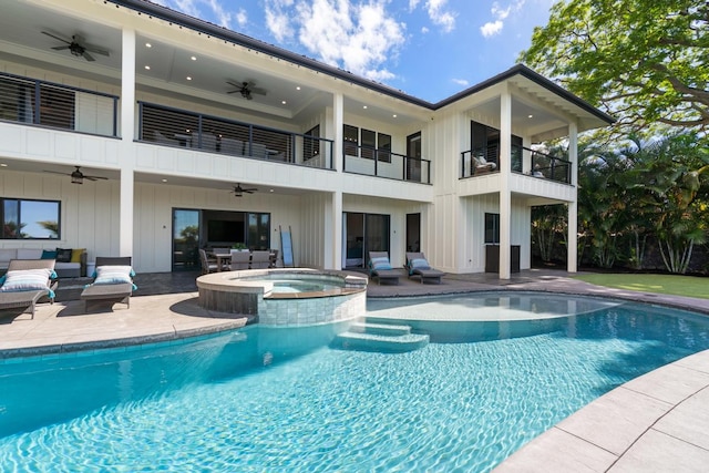 view of pool with an in ground hot tub and a patio