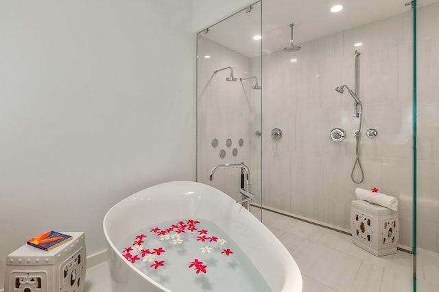 bathroom featuring tile patterned floors and plus walk in shower