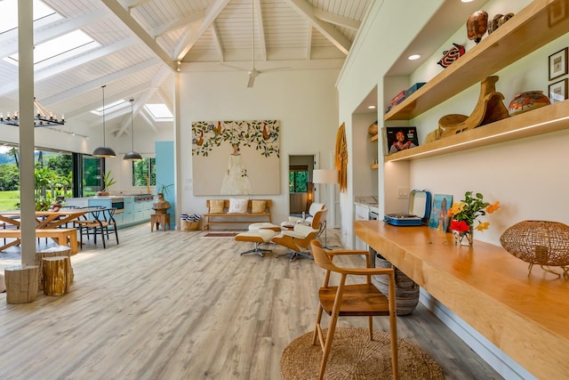 interior space featuring hardwood / wood-style flooring, beam ceiling, and high vaulted ceiling