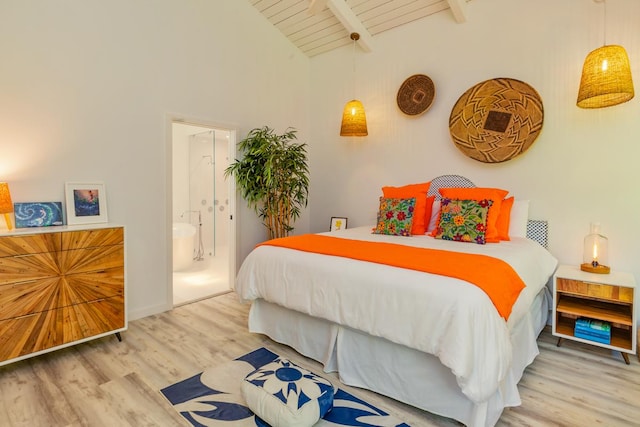 bedroom featuring ensuite bath, beamed ceiling, high vaulted ceiling, wood ceiling, and hardwood / wood-style flooring