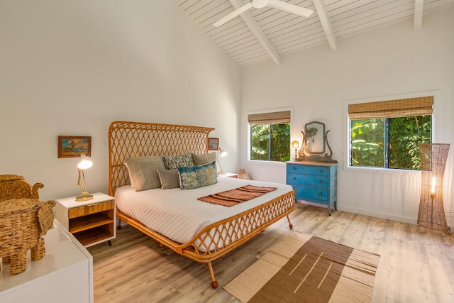 bedroom with wood ceiling, ceiling fan, high vaulted ceiling, beamed ceiling, and light hardwood / wood-style floors