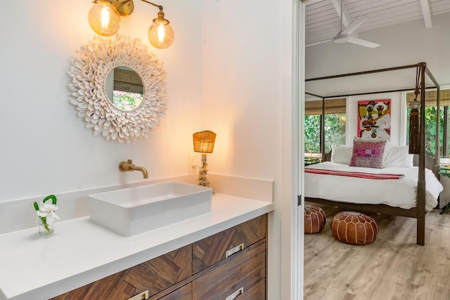 bathroom featuring vanity, beamed ceiling, wooden ceiling, and hardwood / wood-style flooring