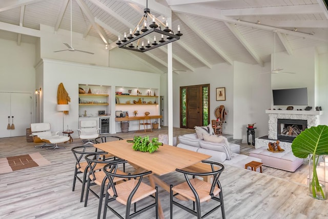 dining space with high vaulted ceiling and ceiling fan