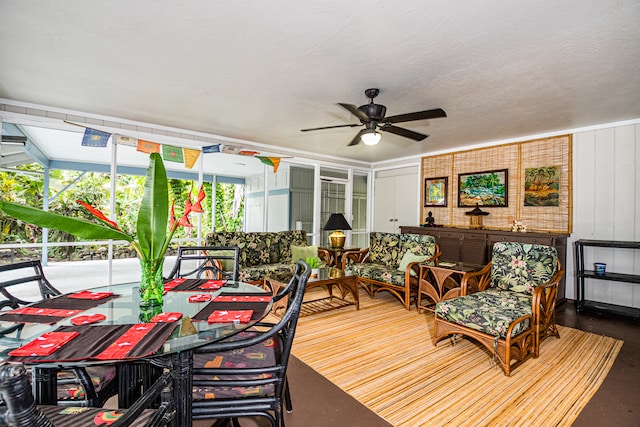 sunroom / solarium with ceiling fan