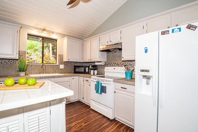 kitchen with white cabinetry, sink, dark wood-type flooring, lofted ceiling, and white appliances