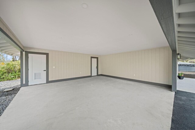 garage featuring wooden walls