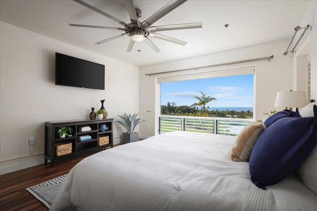 bedroom featuring ceiling fan and dark wood-type flooring