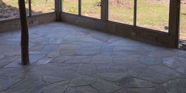 unfurnished sunroom with a healthy amount of sunlight