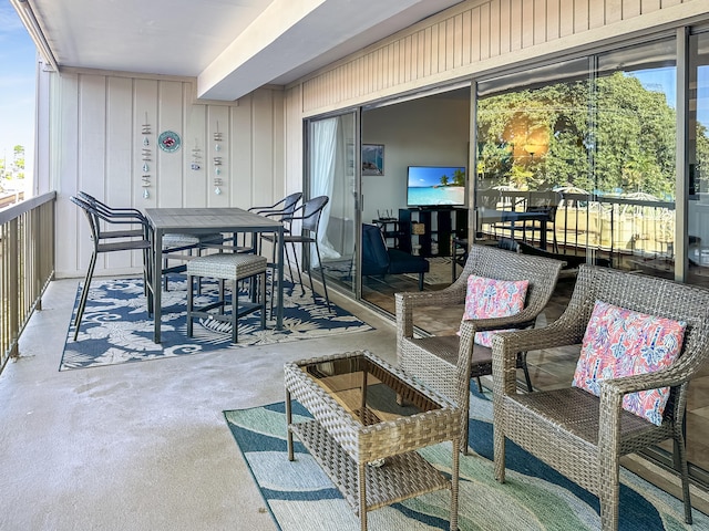 view of patio featuring a balcony