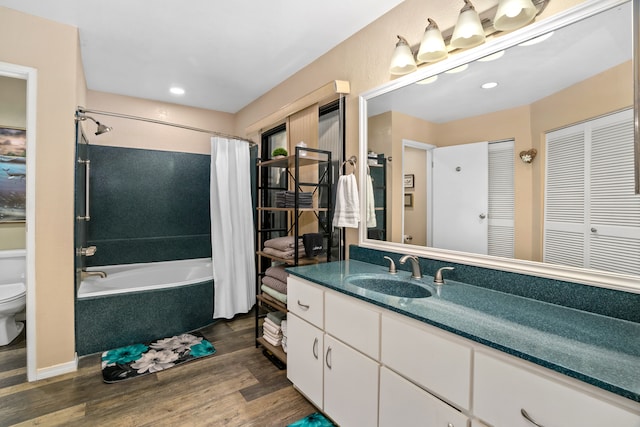 full bathroom with shower / bathtub combination with curtain, vanity, toilet, and wood-type flooring