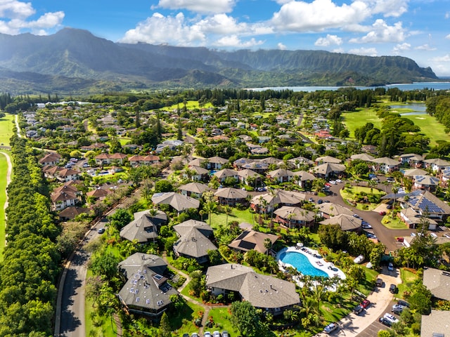 drone / aerial view featuring a water and mountain view