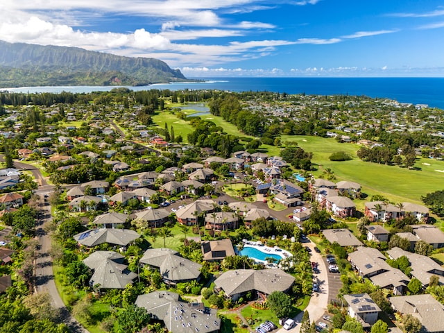 drone / aerial view with a water and mountain view