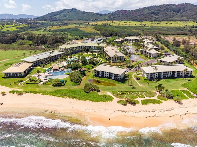 drone / aerial view with a water and mountain view