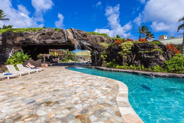 view of swimming pool featuring a patio area and pool water feature