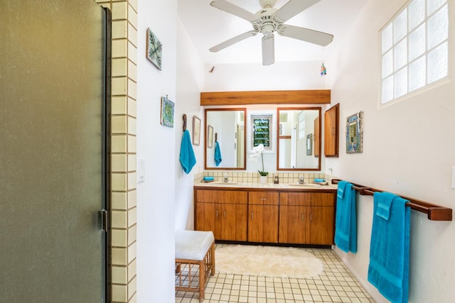 bathroom featuring ceiling fan, tile patterned flooring, a healthy amount of sunlight, and a shower with shower door