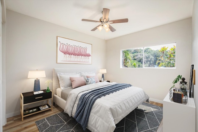 bedroom with wood-type flooring and ceiling fan